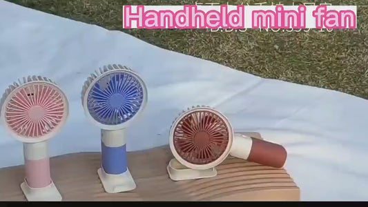 Hand held mini fan with mobile stand